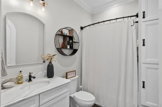 a view of a balcony and dining room
