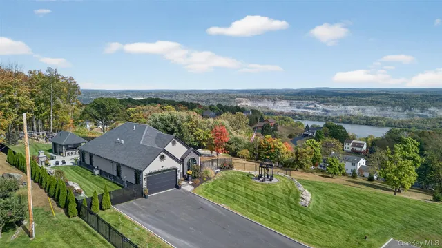a view of a house with backyard and porch
