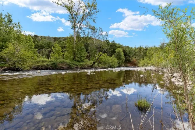 a view of a lake with houses in the back