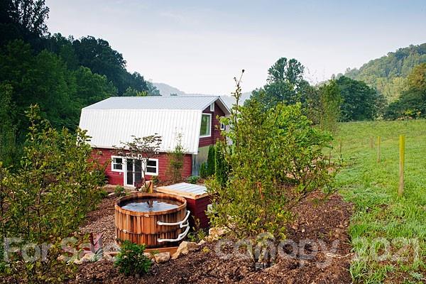 215 Meadow Branch Road Marshall, NC 28753 - Photo 6 of 32 an aerial view of a house with table and chairs