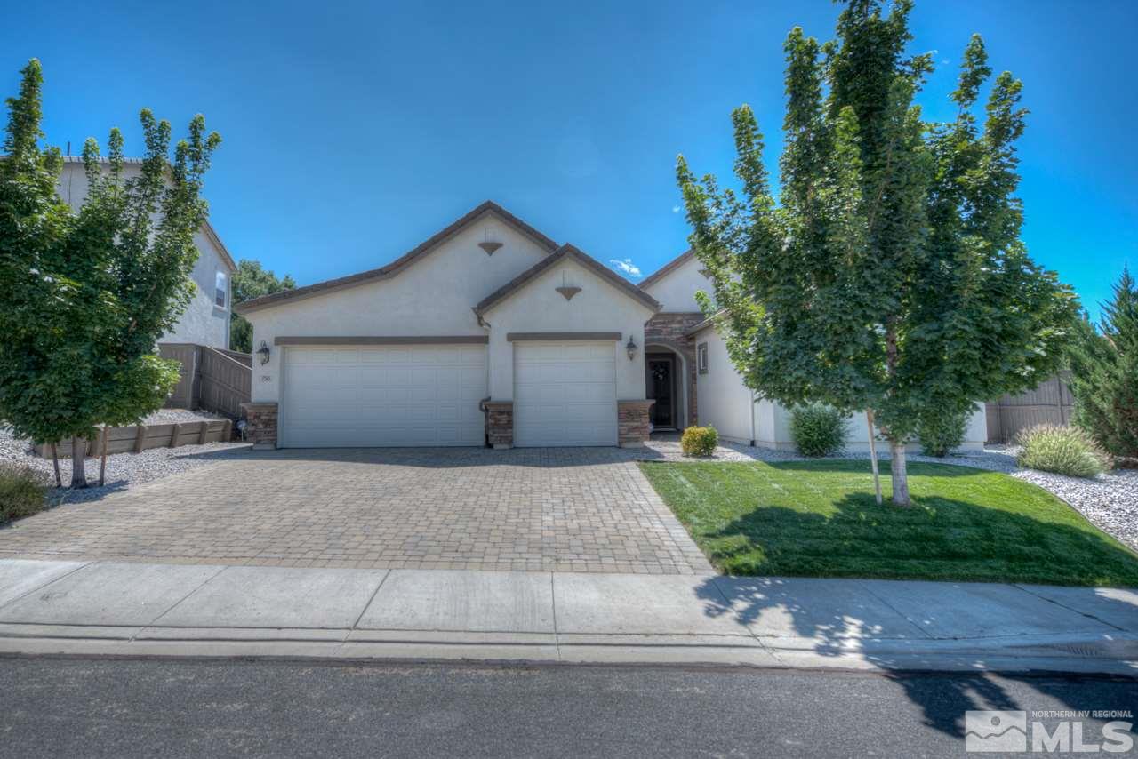 750 Sienna Station Way Reno, NV 89512 - Photo 1 of 21 a front view of a house with a yard and garage