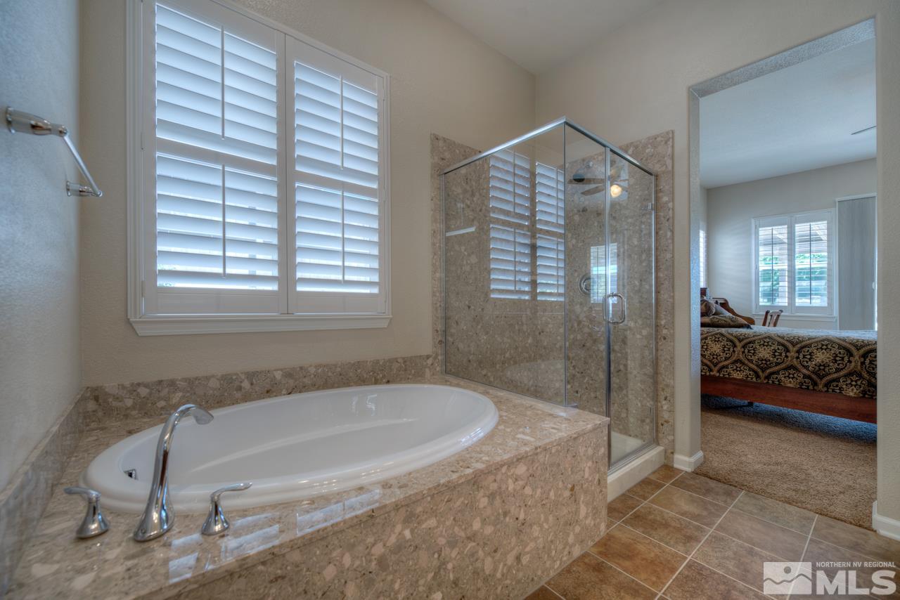 750 Sienna Station Way Reno, NV 89512 - Photo 14 of 21 a spacious bathroom with a tub and shower