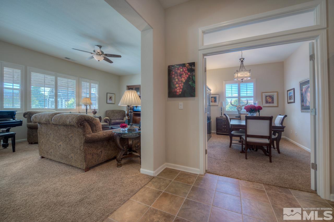 750 Sienna Station Way Reno, NV 89512 - Photo 5 of 21 a living room with furniture and a dining table