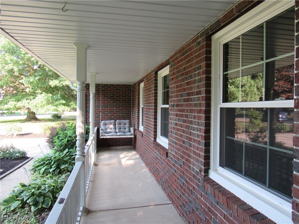 1120 Vincent Road Southeast North Canton, OH 44720 - Photo 5 of 50 Inviting covered porch with swing
