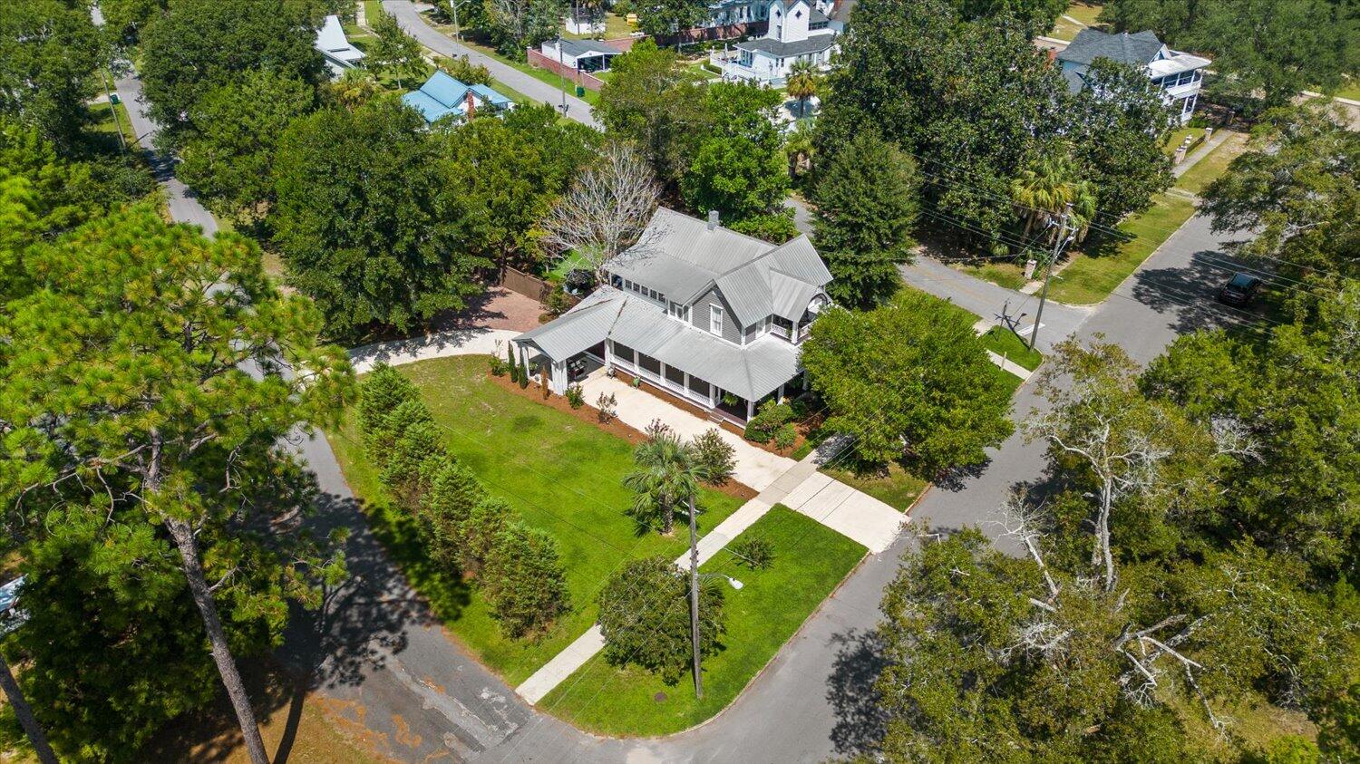 54 Plateau Avenue DeFuniak Springs, FL 32435 - Photo 101 of 114 an aerial view of a house with a yard basket ball court and outdoor seating