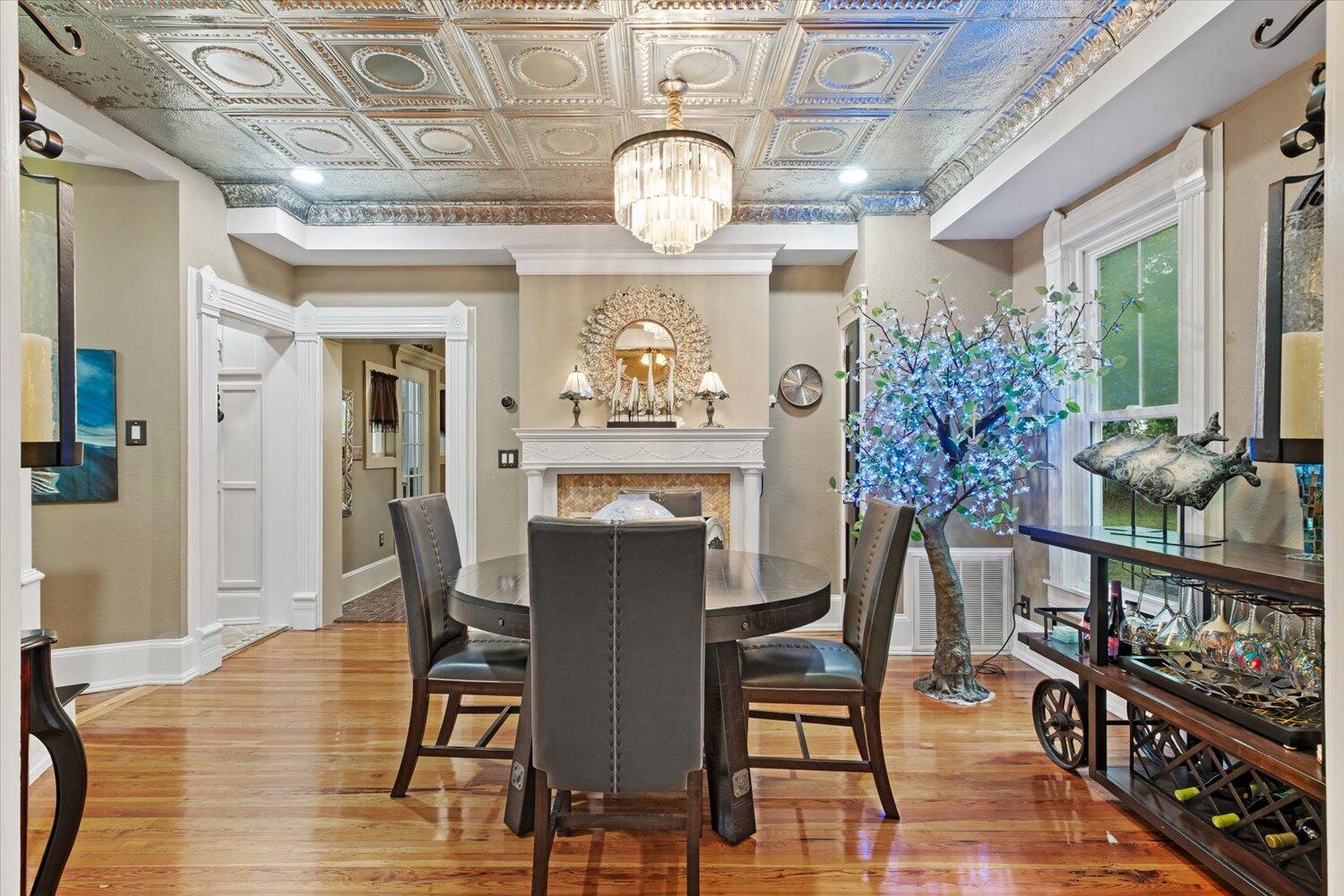 54 Plateau Avenue DeFuniak Springs, FL 32435 - Photo 17 of 114 a view of a dining room with furniture a chandelier and wooden floor