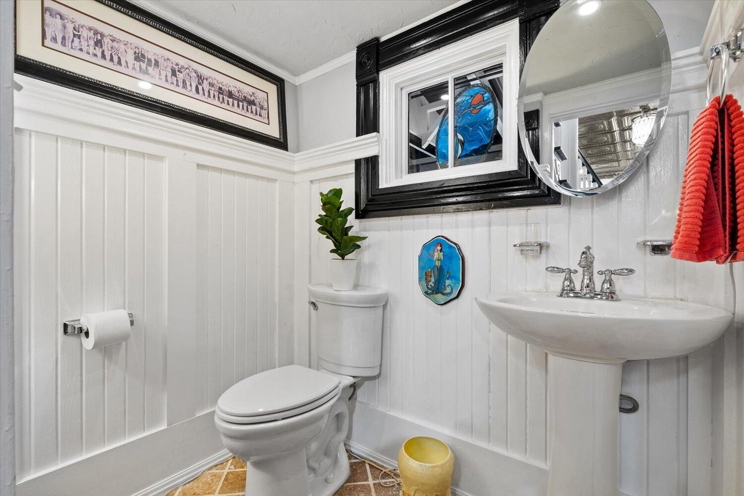 54 Plateau Avenue DeFuniak Springs, FL 32435 - Photo 31 of 114 a bathroom with a sink a toilet and mirror