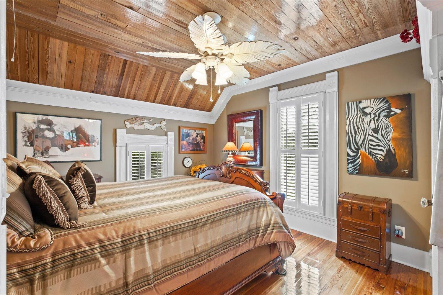 54 Plateau Avenue DeFuniak Springs, FL 32435 - Photo 47 of 114 a bedroom with a bed a dresser and next to a window