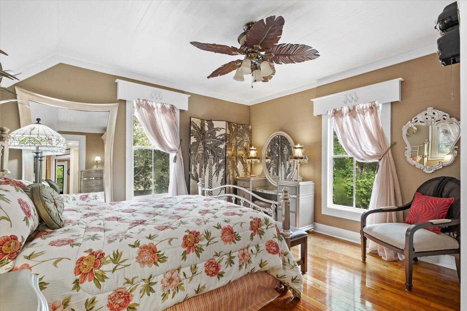 54 Plateau Avenue DeFuniak Springs, FL 32435 - Photo 48 of 114 a bedroom with a bed a chandelier and dresser