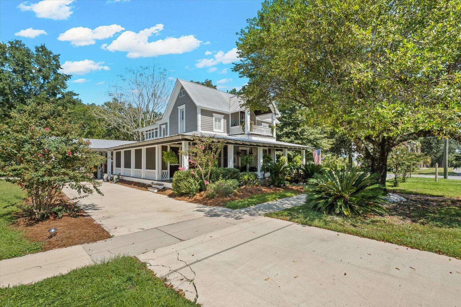 54 Plateau Avenue DeFuniak Springs, FL 32435 - Photo 77 of 114 a front view of a house with a garden