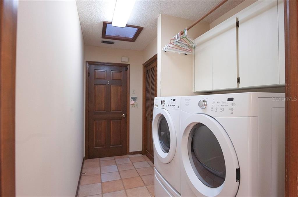 145 Spring Chase Circle Altamonte Springs, FL 32714 - Photo 33 of 54 The laundry room washer & dryer convey, has cabinets and a huge closet!