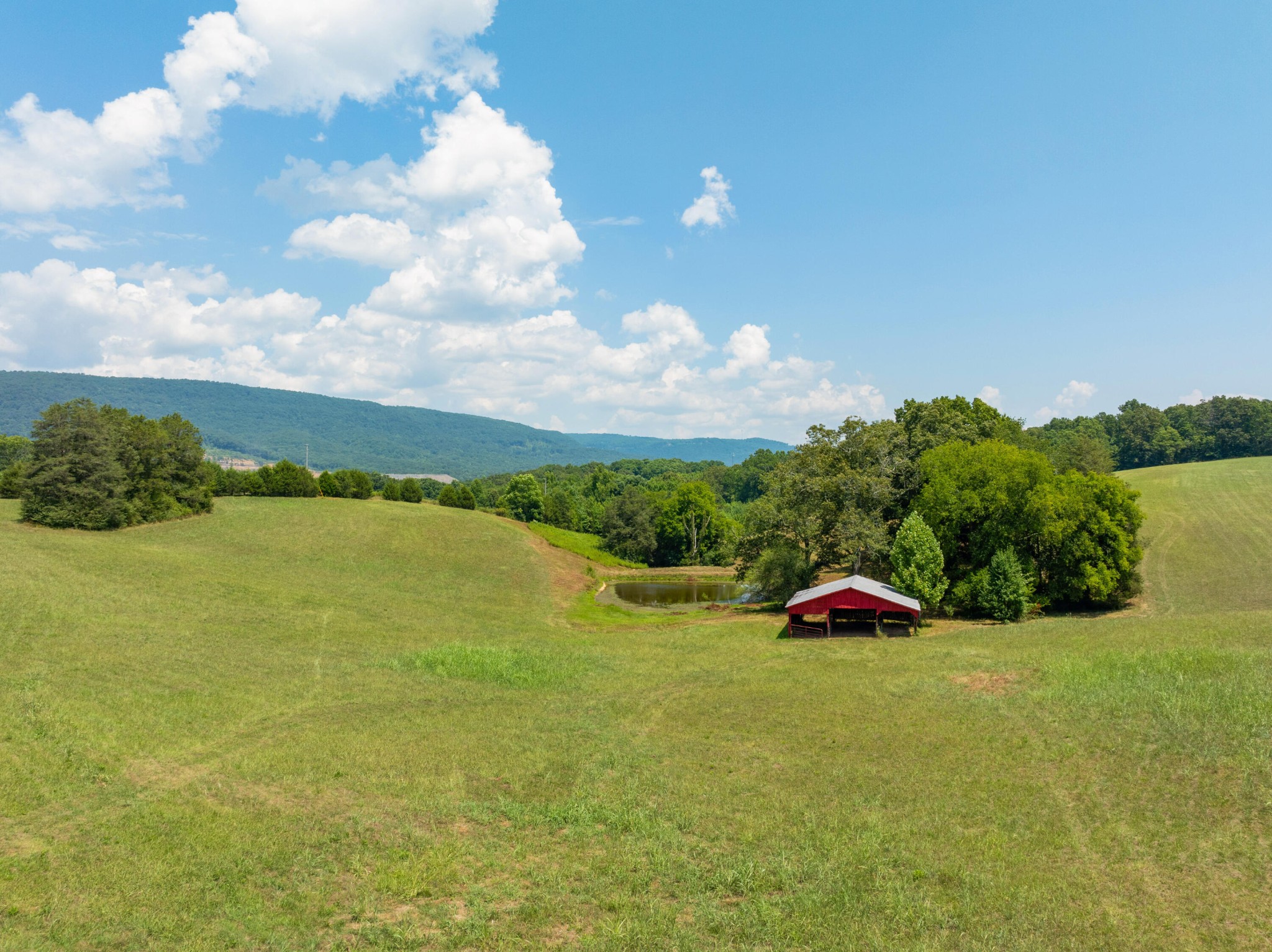 0 John Burch Road West Dunlap, TN 37327 - Photo 19 of 29 a view of a lake and houses in the back