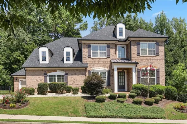 front view of a house with a yard