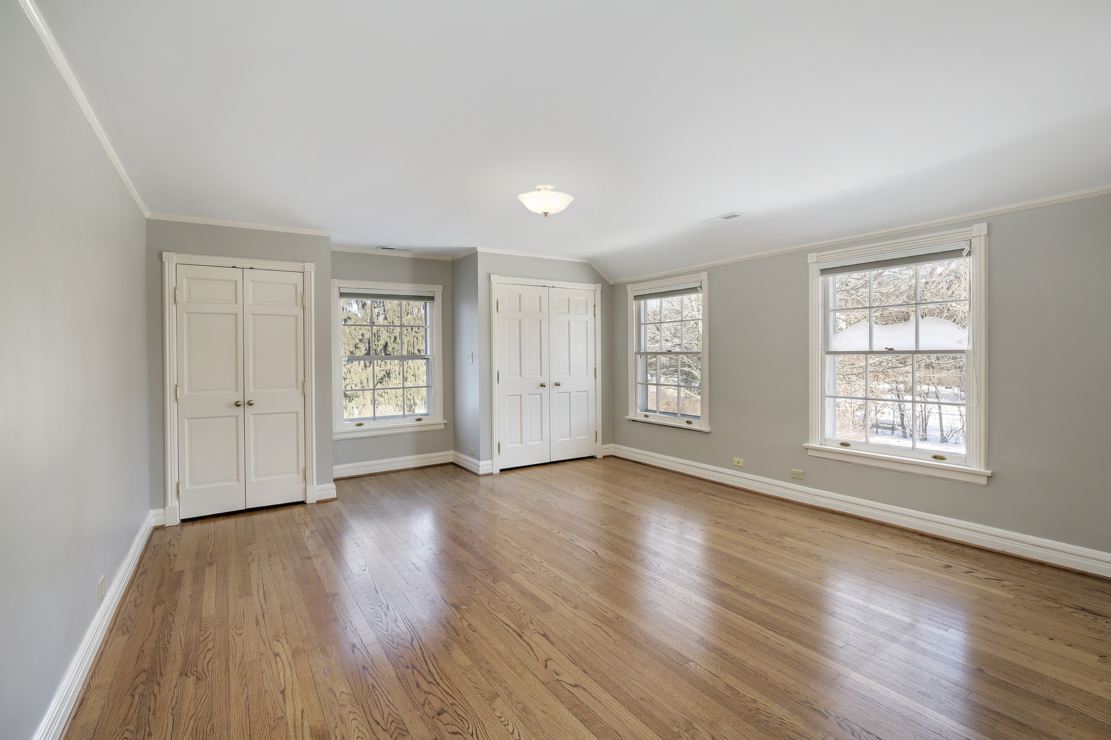 834 Valley Road Glencoe, IL 60022 - Photo 16 of 25 an empty room with wooden floor and windows