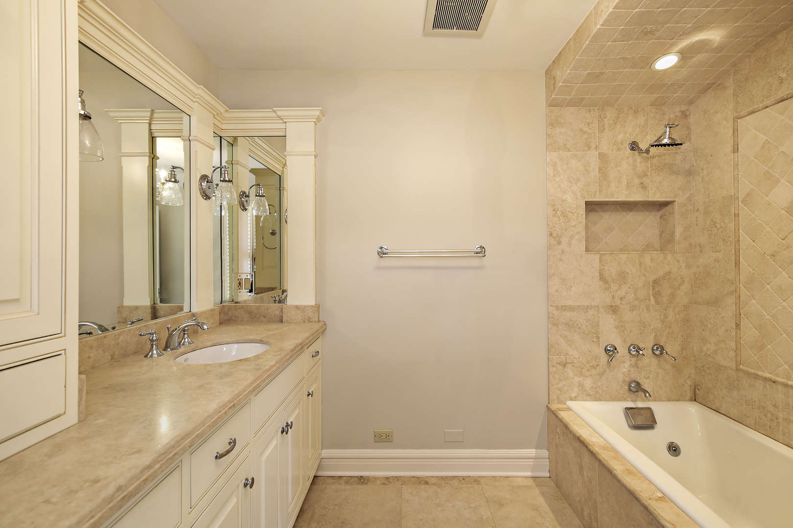 834 Valley Road Glencoe, IL 60022 - Photo 20 of 25 a bathroom with a tub sink and mirror