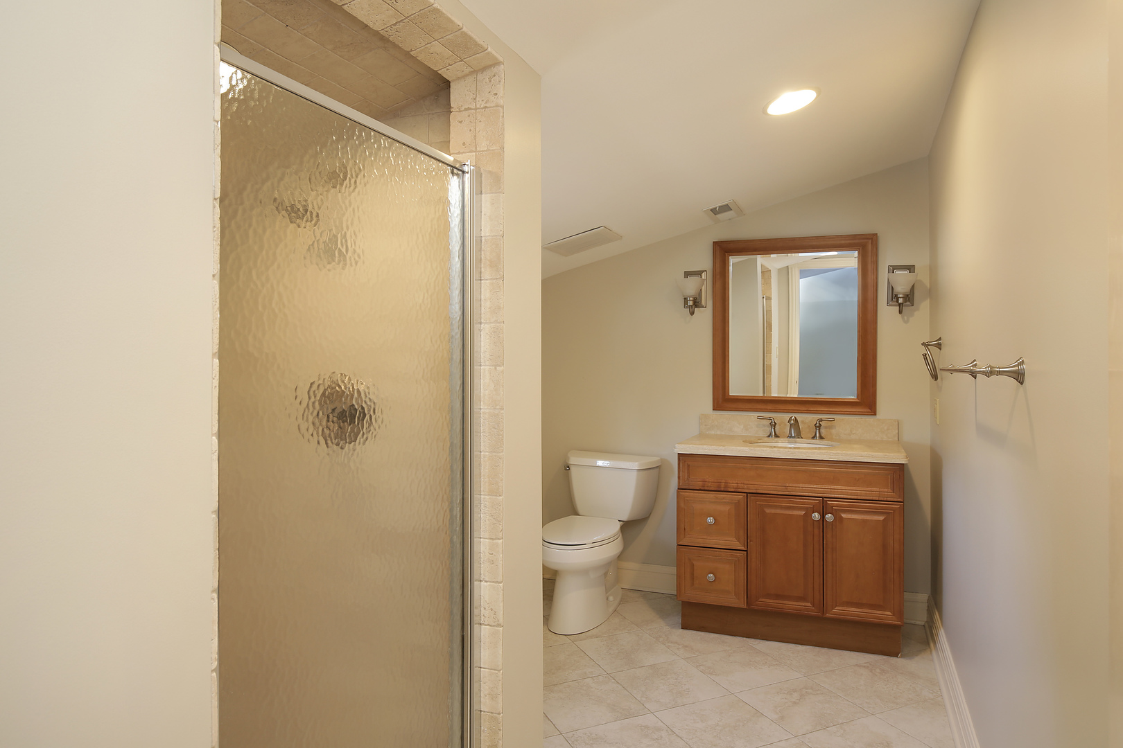 834 Valley Road Glencoe, IL 60022 - Photo 24 of 25 a spacious bathroom with a granite countertop sink a toilet and a shower