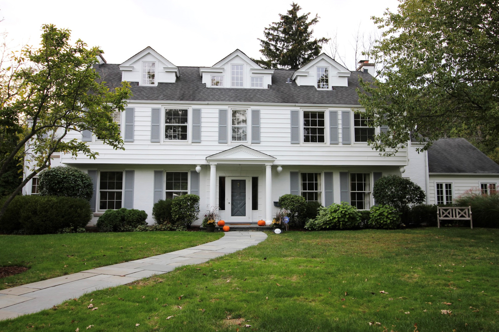 834 Valley Road Glencoe, IL 60022 - Photo 3 of 25 a front view of a house with garden and trees
