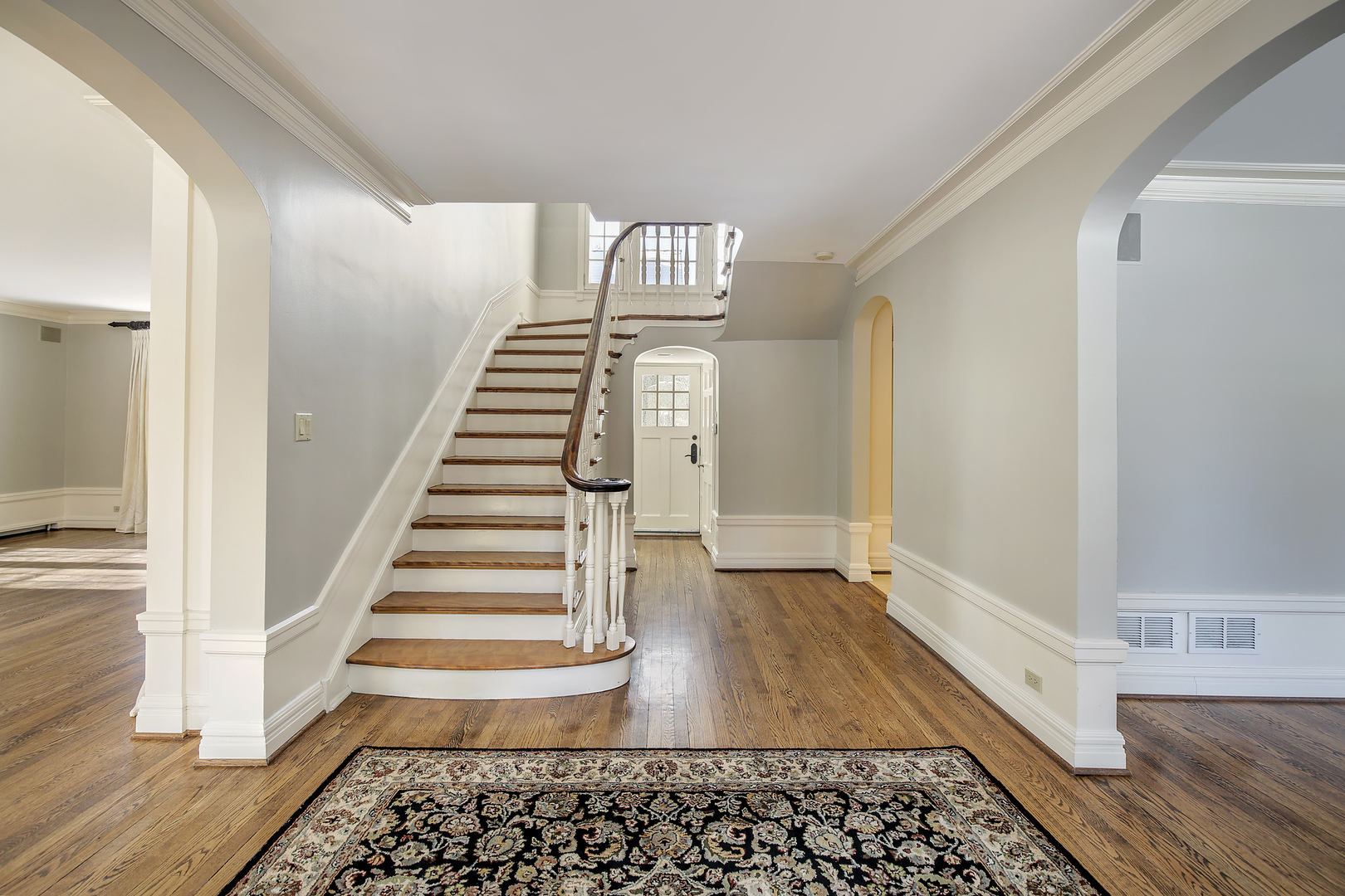 834 Valley Road Glencoe, IL 60022 - Photo 4 of 25 a view of entryway with stairs and wooden floor