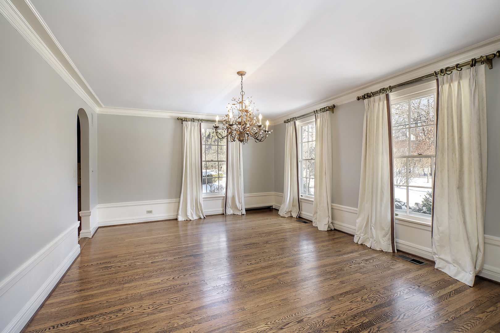 834 Valley Road Glencoe, IL 60022 - Photo 6 of 25 a view of an empty room with wooden floor and a window