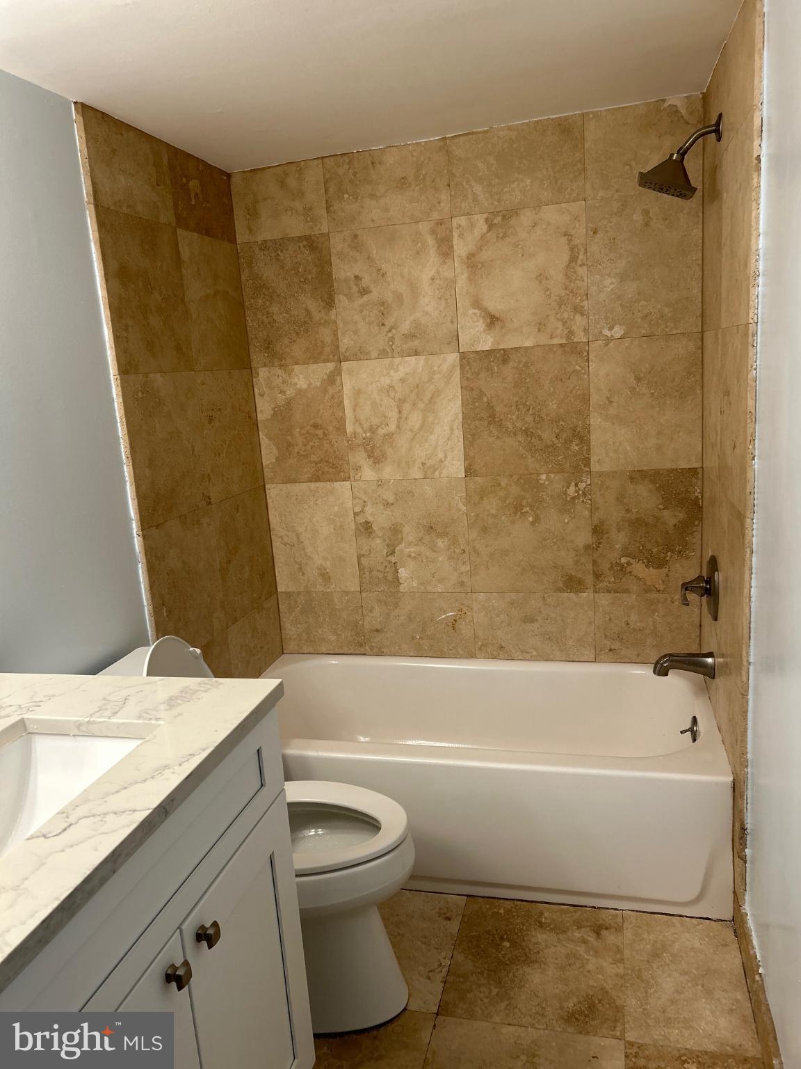 5823 Royal Ridge Drive, Unit D Springfield, VA 22152 - Photo 11 of 12 Elegant bathroom with natural stone accents.