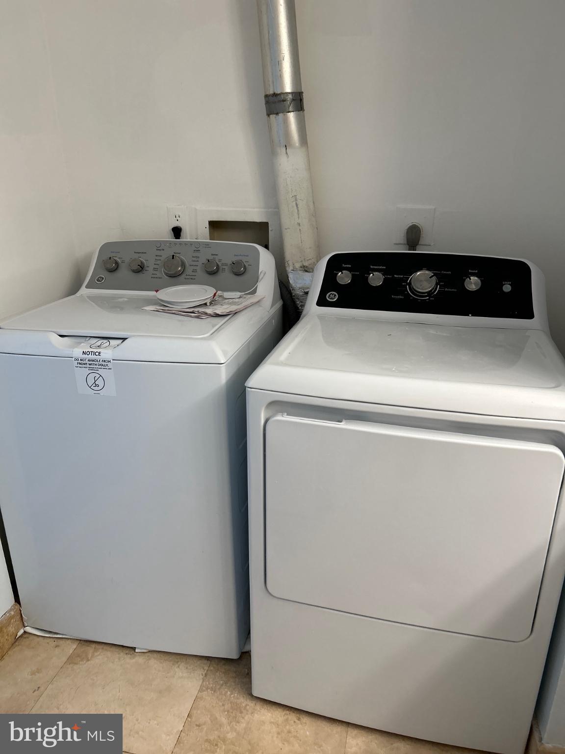 5823 Royal Ridge Drive, Unit D Springfield, VA 22152 - Photo 12 of 12 Modern laundry appliances for efficient living.