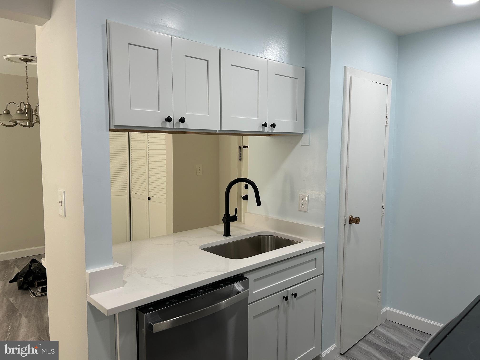 5823 Royal Ridge Drive, Unit D Springfield, VA 22152 - Photo 3 of 12 Modern kitchen with sleek finishes.