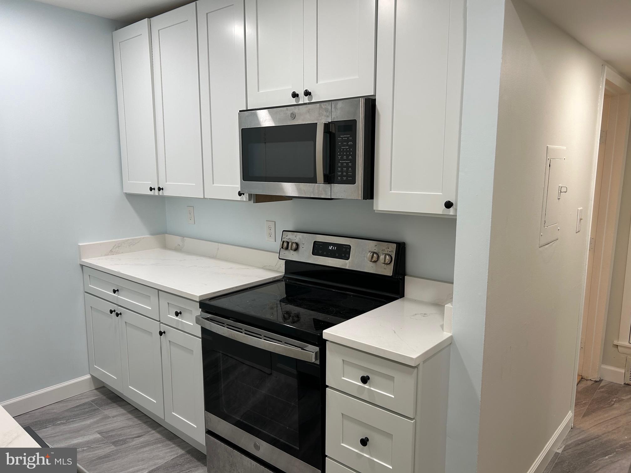 5823 Royal Ridge Drive, Unit D Springfield, VA 22152 - Photo 4 of 12 Modern kitchen with sleek finishes.