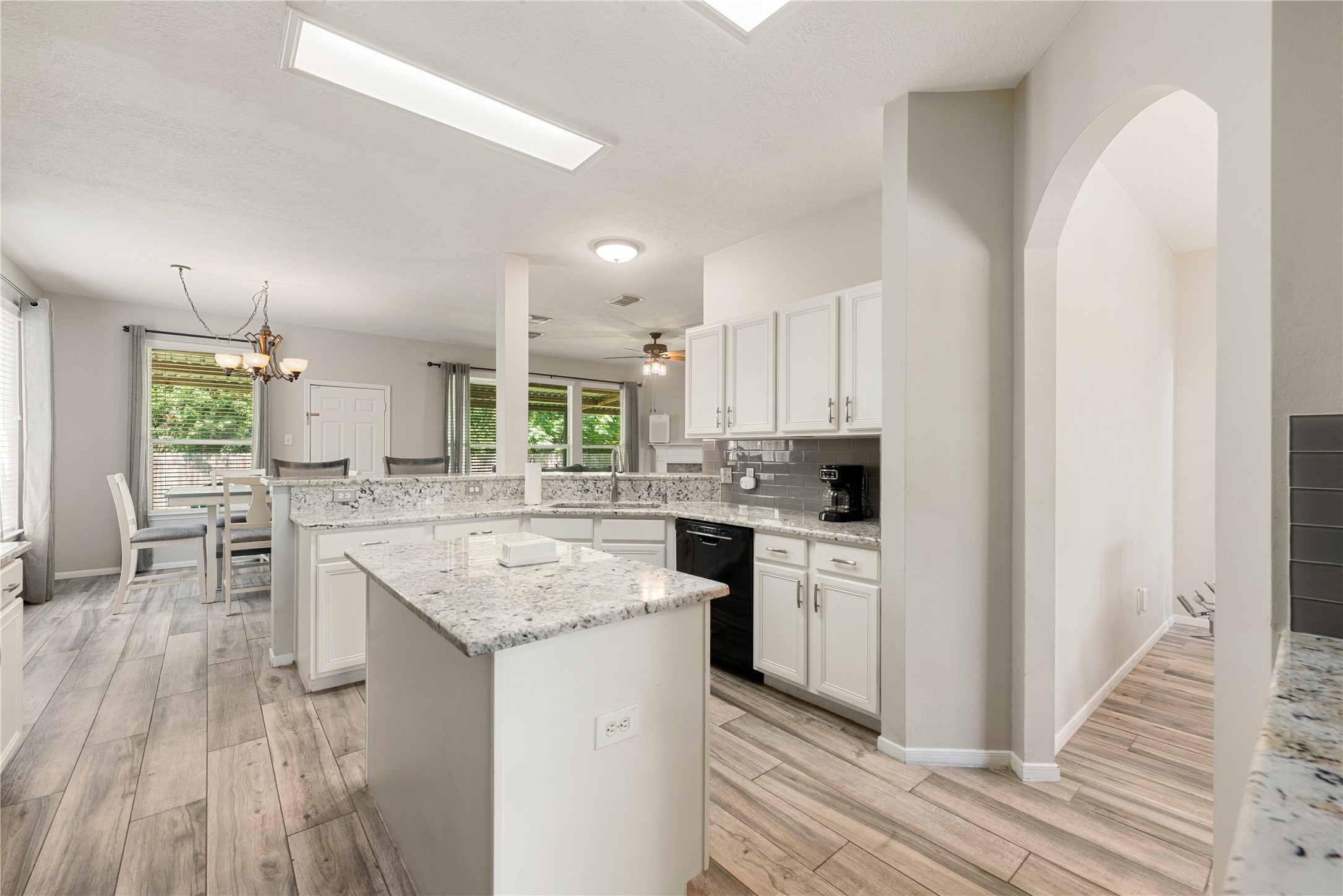 19726 Teller Boulevard Spring, TX 77388 - Photo 7 of 24 The sleek black appliances provide a modern contrast, while the open layout flows seamlessly into the rest of the home, making it perfect for keeping the conversation going while you cook.