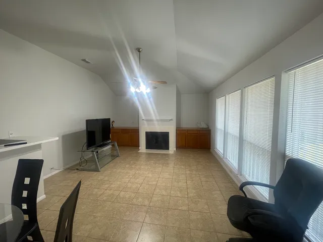 a view of a livingroom with furniture and a chair