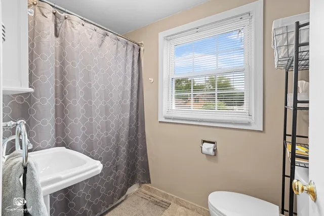 a bathroom with a sink and toilet