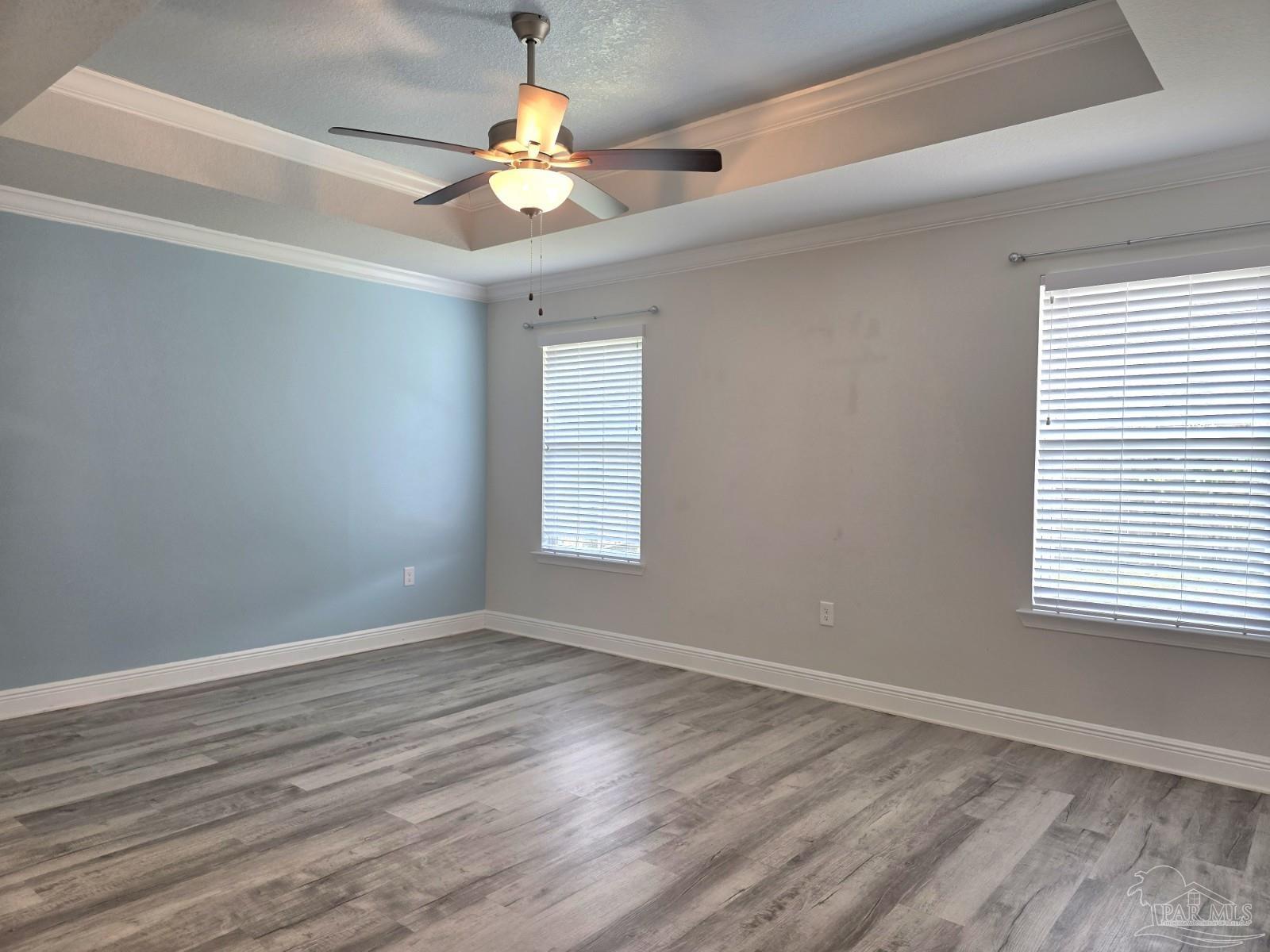 5031 Firstmate Way Pensacola, FL 32526 - Photo 11 of 27 wooden floor in an empty room with a window