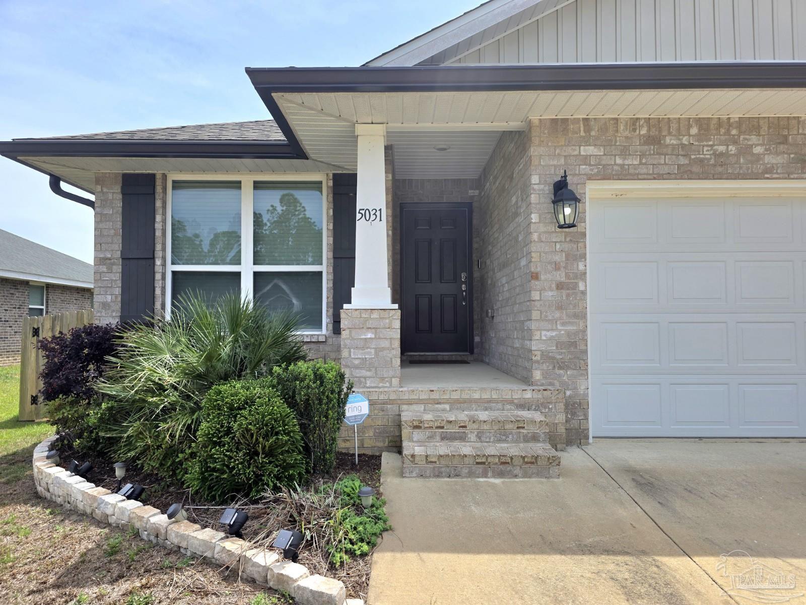 5031 Firstmate Way Pensacola, FL 32526 - Photo 2 of 27 a front view of a house with garden