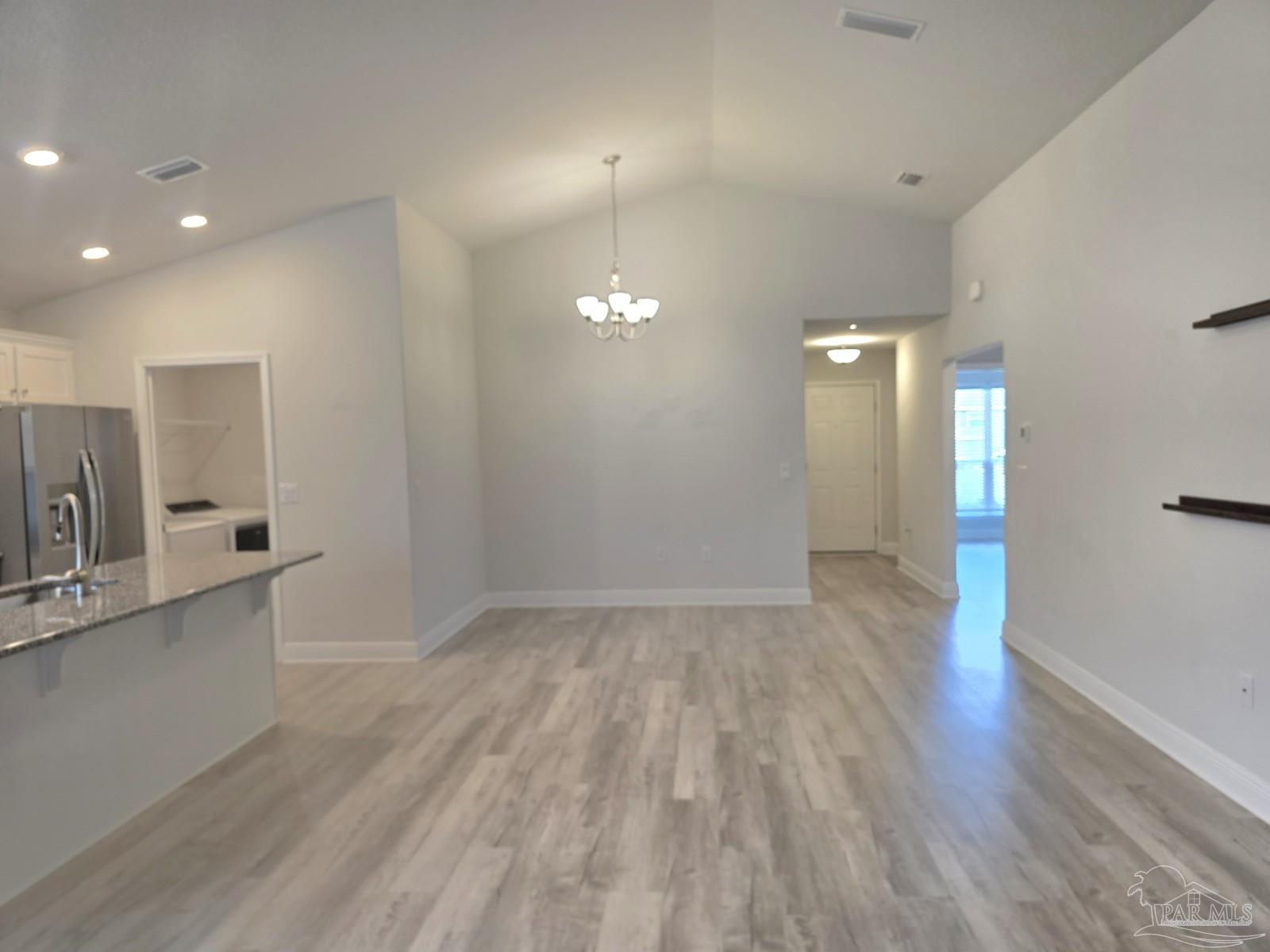 5031 Firstmate Way Pensacola, FL 32526 - Photo 5 of 27 a view of a kitchen with a sink and dishwasher wooden floor