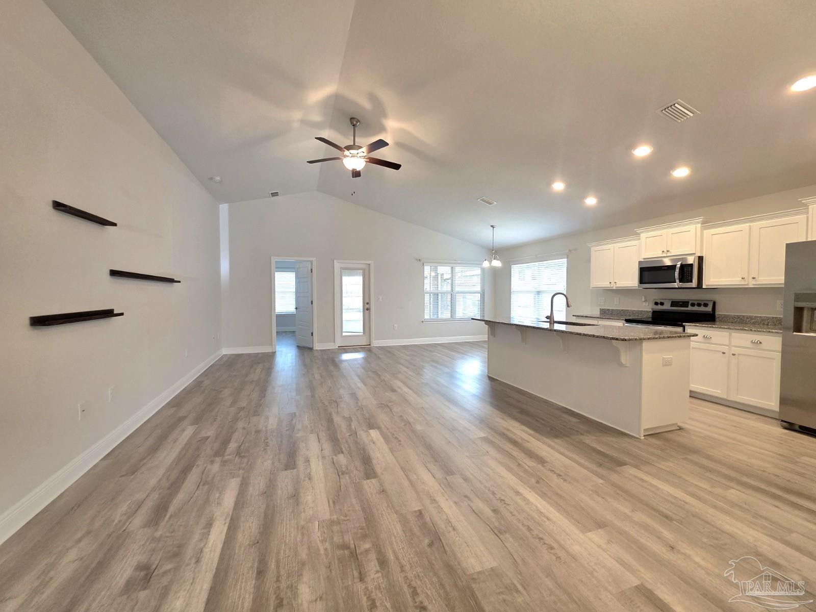 5031 Firstmate Way Pensacola, FL 32526 - Photo 6 of 27 a view of kitchen with cabinets and wooden floor