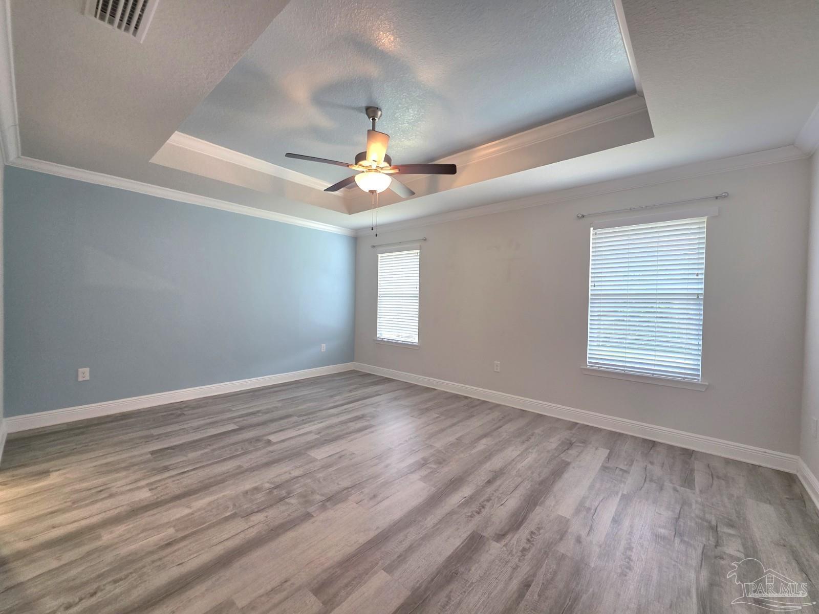 5031 Firstmate Way Pensacola, FL 32526 - Photo 9 of 27 wooden floor in an empty room with a window