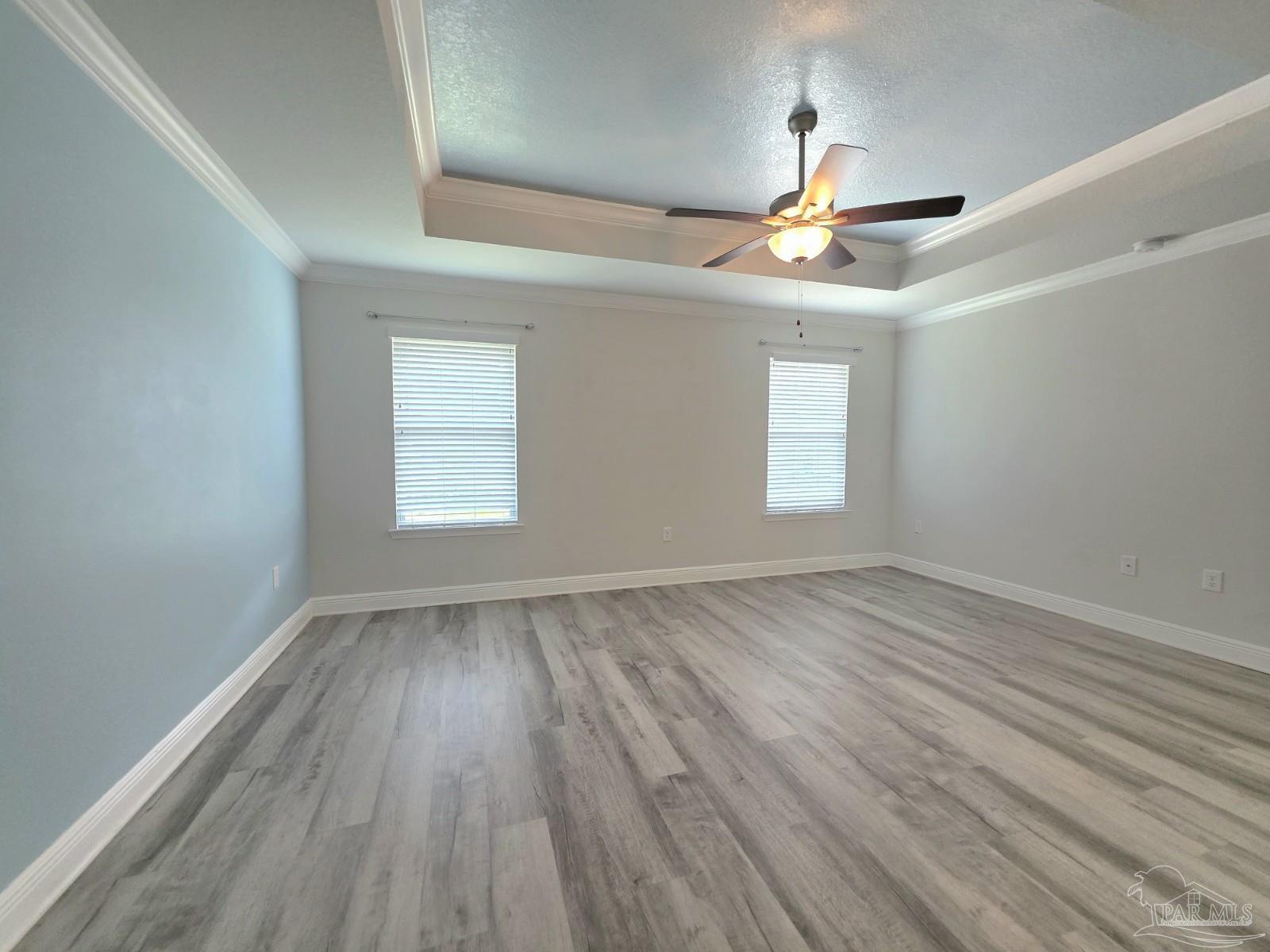 5031 Firstmate Way Pensacola, FL 32526 - Photo 10 of 27 an empty room with wooden floor ceiling fan and window