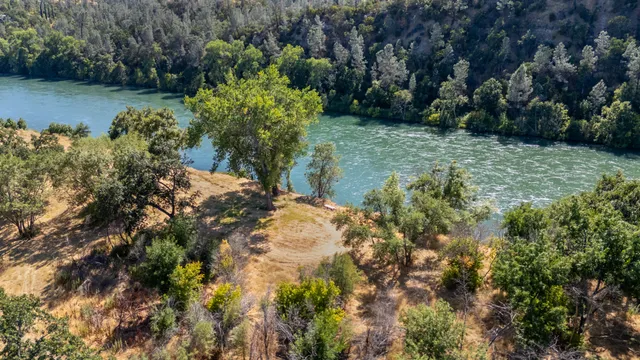 a view of a lake with a yard