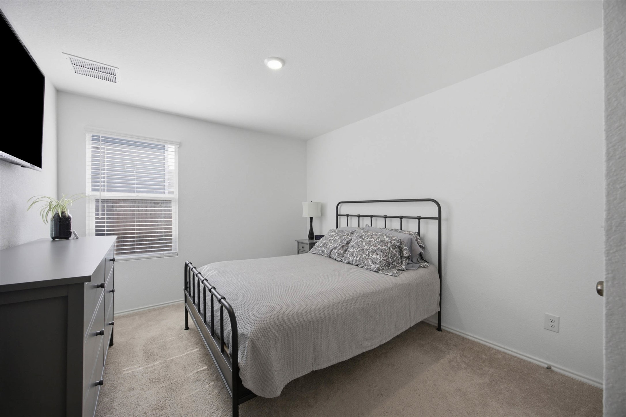 171 Cattle Queen Road Jarrell, TX 76537 - Photo 25 of 38 Warm carpeting floor and smooth walls define this comfortable bedroom layout.