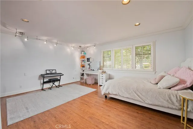 a bathroom with a tub a sink and mirror