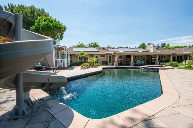 a view of a chairs and table in the patio