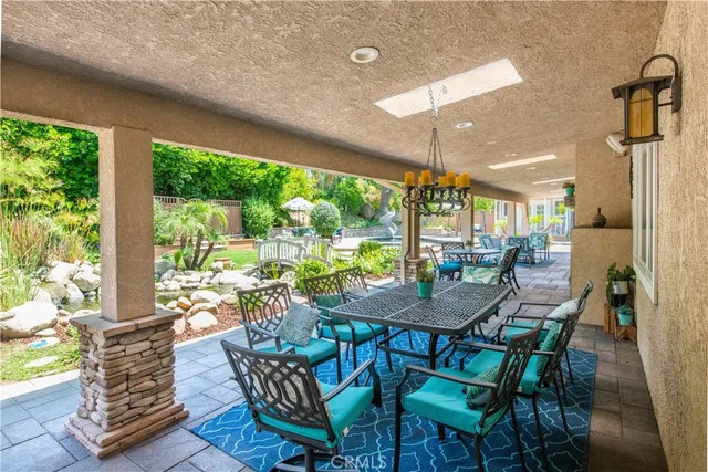 a dining room with furniture a rug and a fireplace