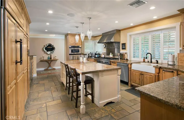 a kitchen with lots of counter top space and appliances