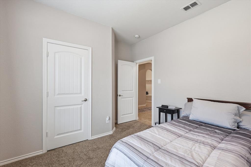 11500 Starlight Ranch Fort Worth, TX 76052 - Photo 28 of 40 This room features neutral-toned carpet flooring and light-colored walls, providing a versatile backdrop