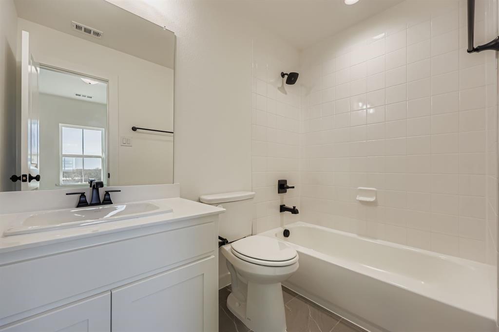 1841 Pk Vista Way Midlothian, TX 76065 - Photo 19 of 28 a bathroom with a sink a toilet and a bathtub