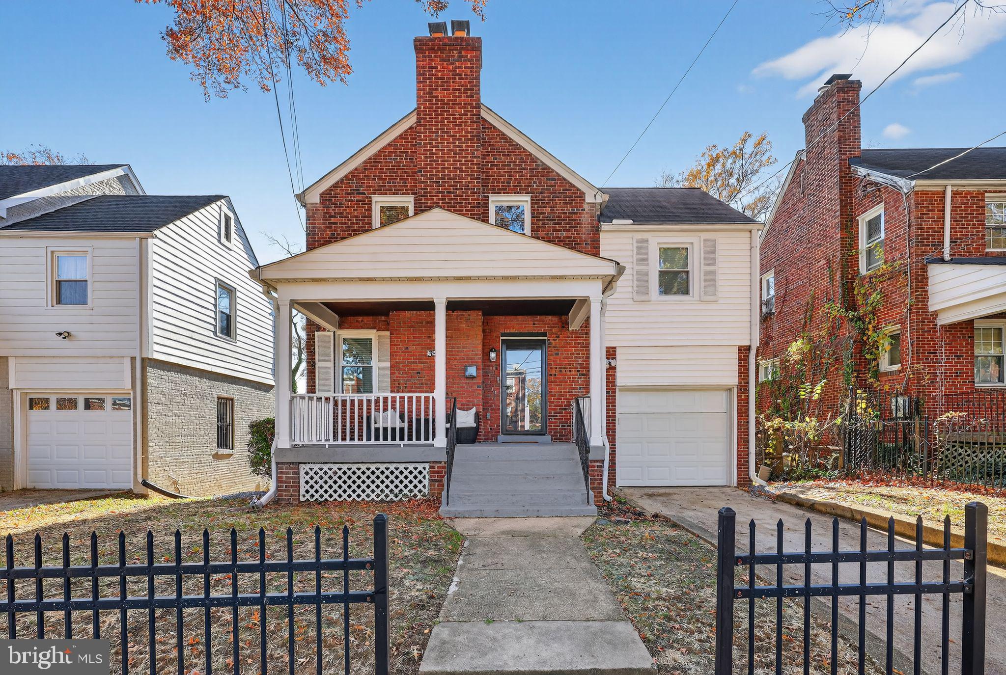 3947 S Street Southeast Washington, DC 20020 - Photo 1 of 28 a front view of a house with a porch