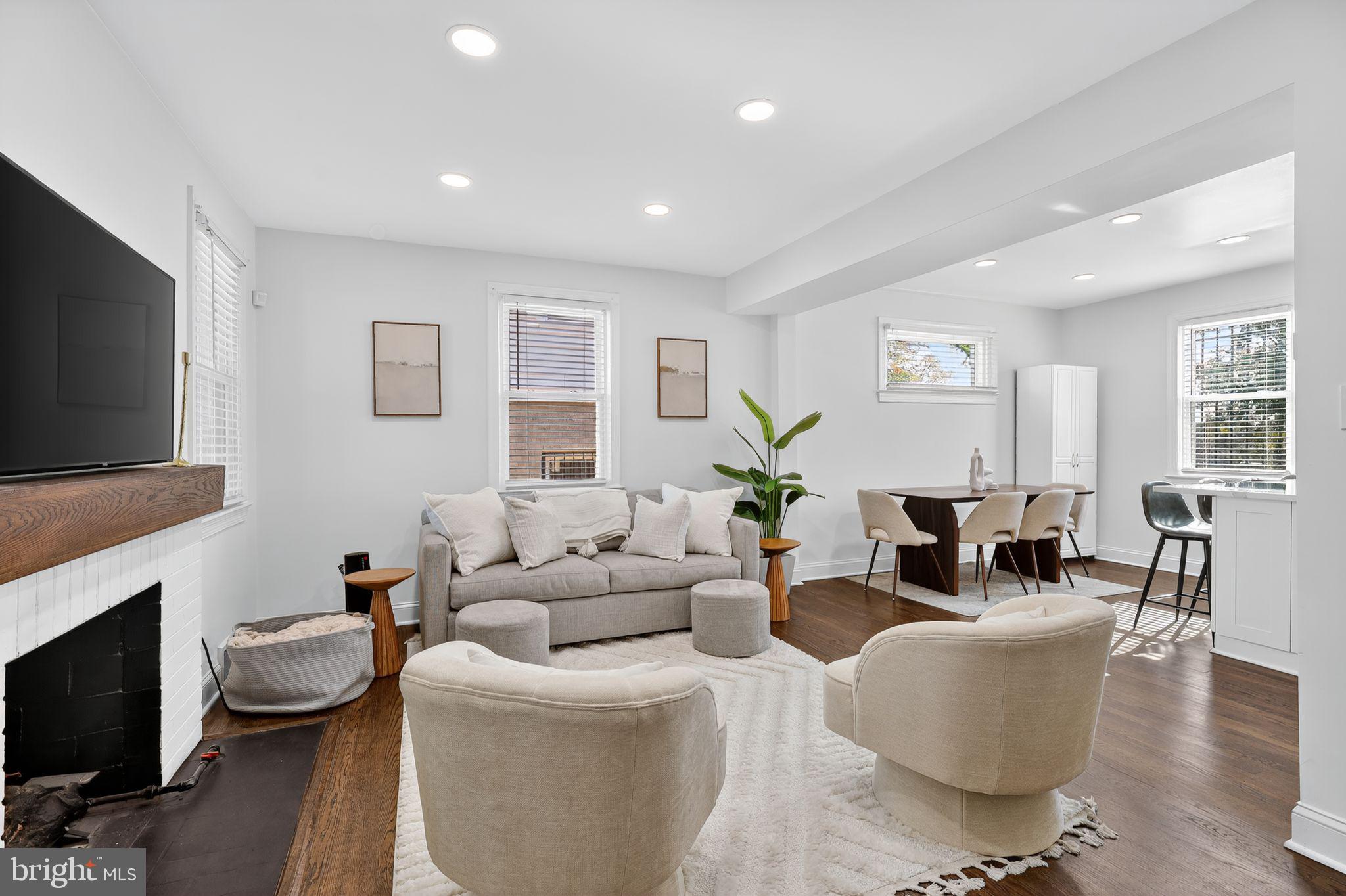 3947 S Street Southeast Washington, DC 20020 - Photo 4 of 28 a living room with fireplace furniture and a flat screen tv