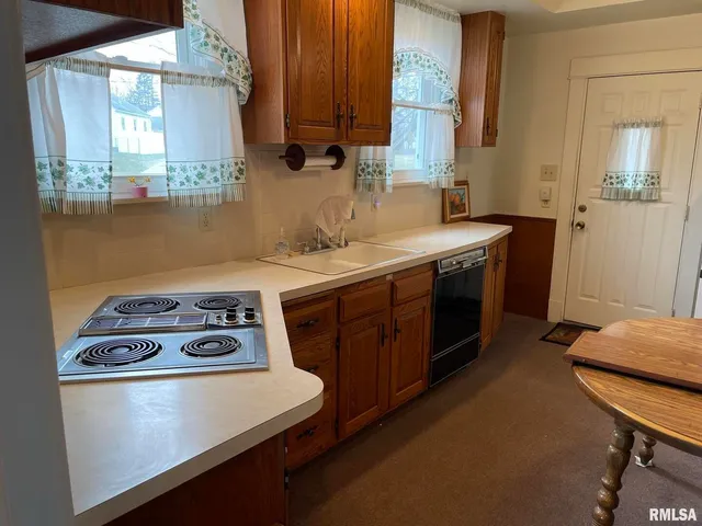 a kitchen with a stove and a sink