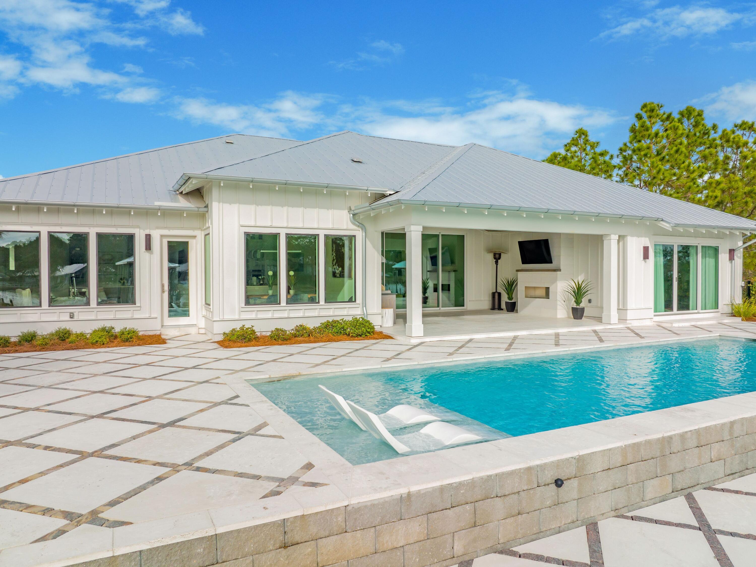 336 East Shipwreck Road Santa Rosa Beach, FL 32459 - Photo 12 of 54 a view of house with swimming pool outdoor seating