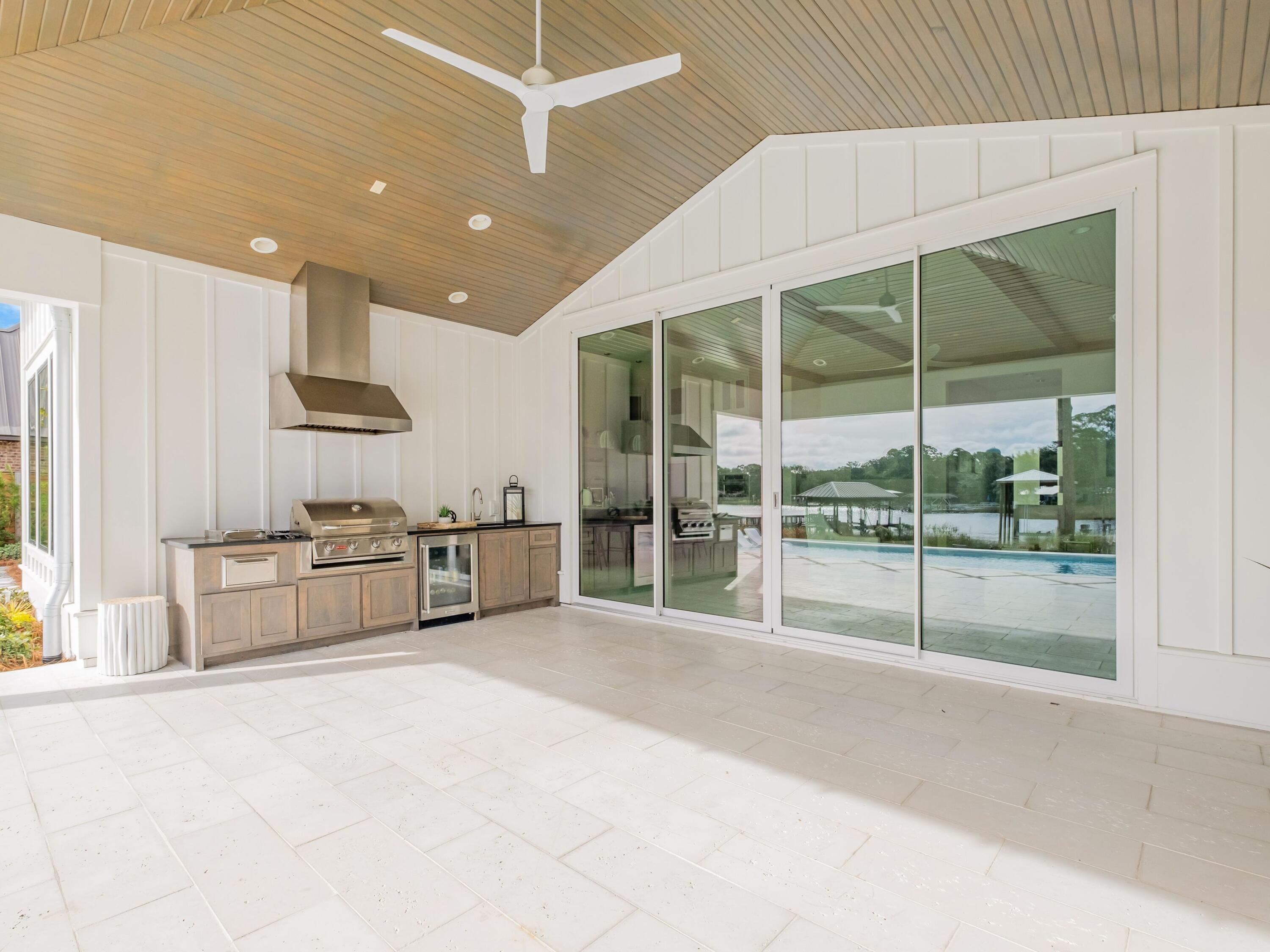 336 East Shipwreck Road Santa Rosa Beach, FL 32459 - Photo 14 of 54 a large white room with a large window and kitchen view