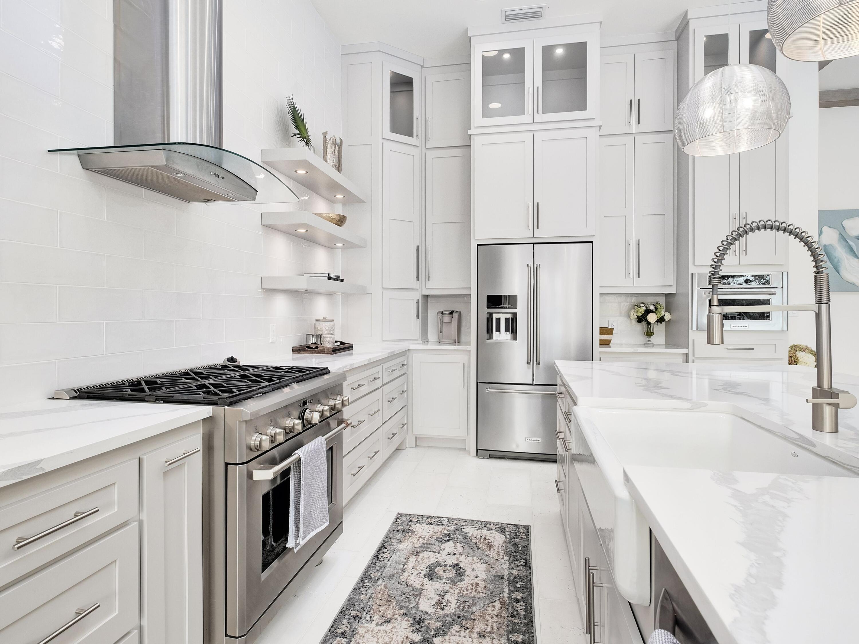 336 East Shipwreck Road Santa Rosa Beach, FL 32459 - Photo 17 of 54 a kitchen with stainless steel appliances granite countertop a stove and a sink